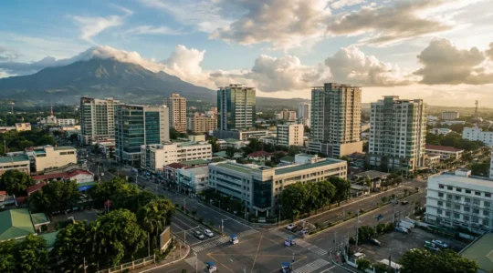 Aerial panoramic view of Davao City's modern skyline with Mount Apo in the background