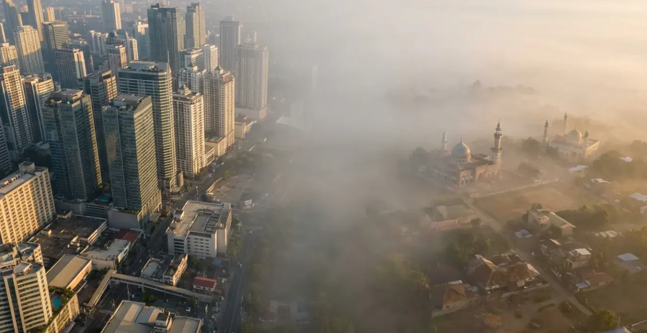 Manila skyline contrasting with Mindanao mosque minarets through layered urban landscapes